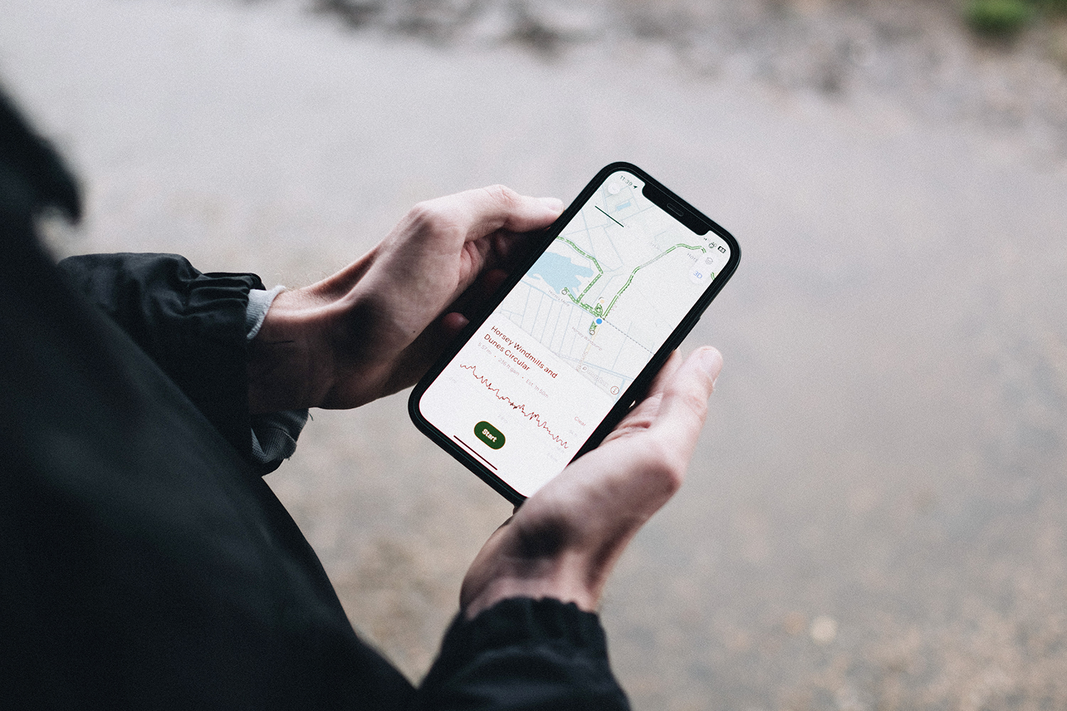 Navigating a walk at Horsey using AllTrails a close-up image of someone using a smartphone to navigate a circular walk at horsey