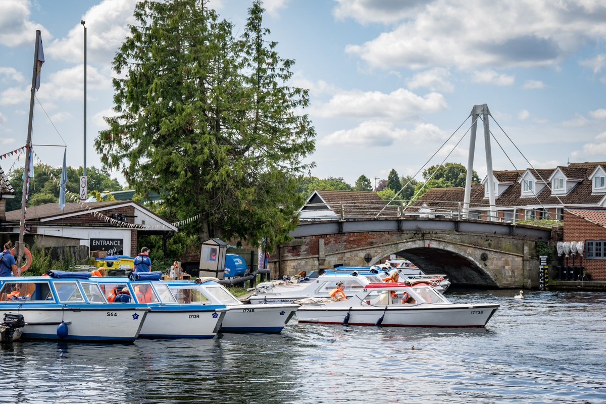 Day boats mooring up near Wroxham Bridge