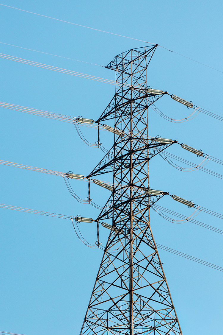 Power stations are an example of a development that constitutes an NSIP A power pylon against a light blue sky