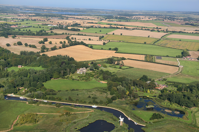 The land upstream of the Broads is mainly arable