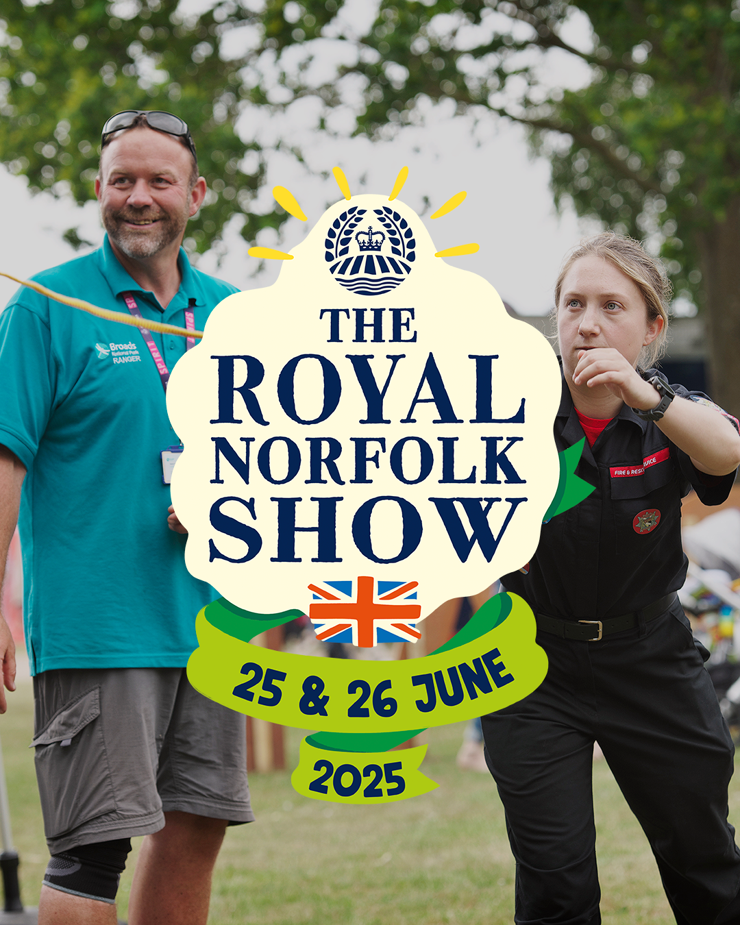 Two people, a man in a teal “Broads Ranger” polo and a woman in a black “Fire & Rescue” uniform, engage in an outdoor activity at an event. Overlaid in the centre is a large emblem reading “The Royal Norfolk Show” with a crown and field logo above it, a Union Jack flag below, and ribbon banners displaying the event dates: “25 & 26 June 2025.” Trees and grass are visible in the background.