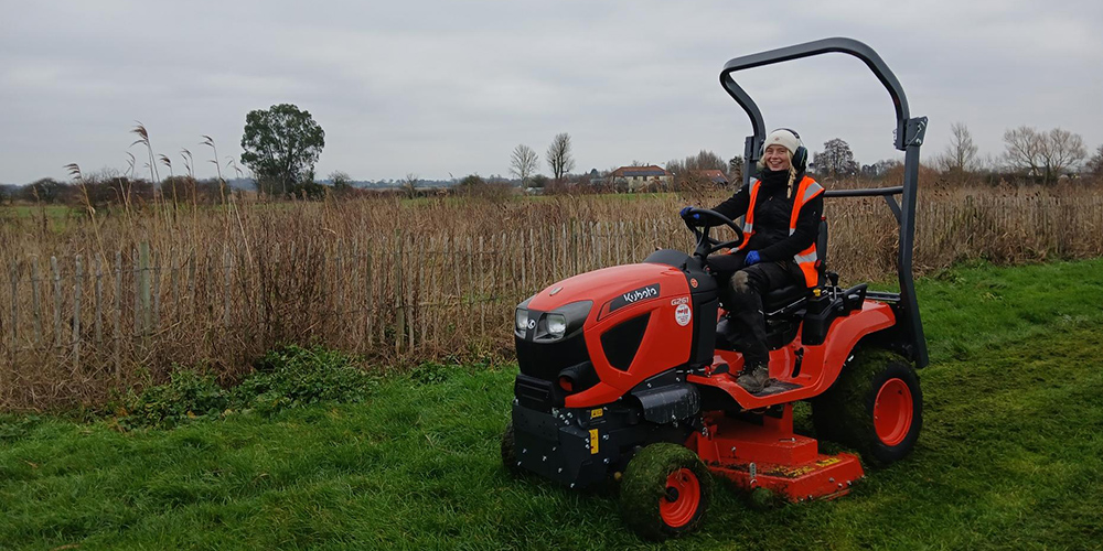 Emma using a ride-on mower