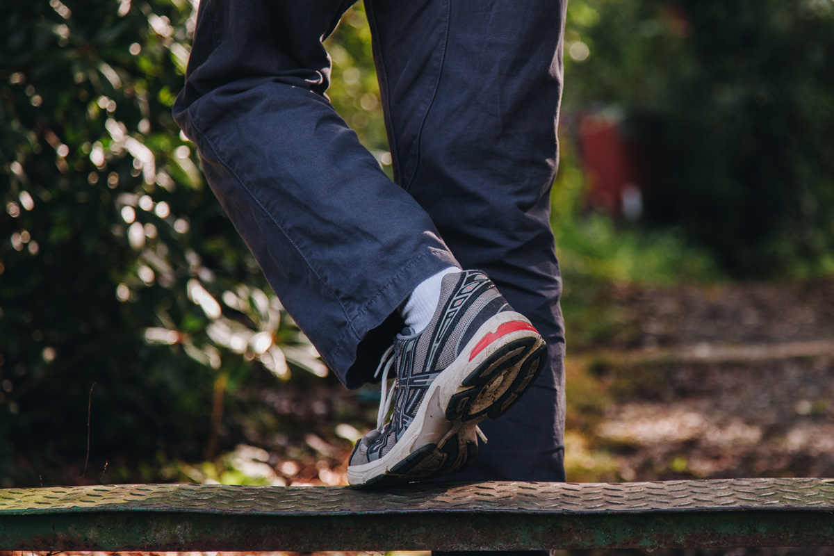 A cropped image of someone crossing a stile