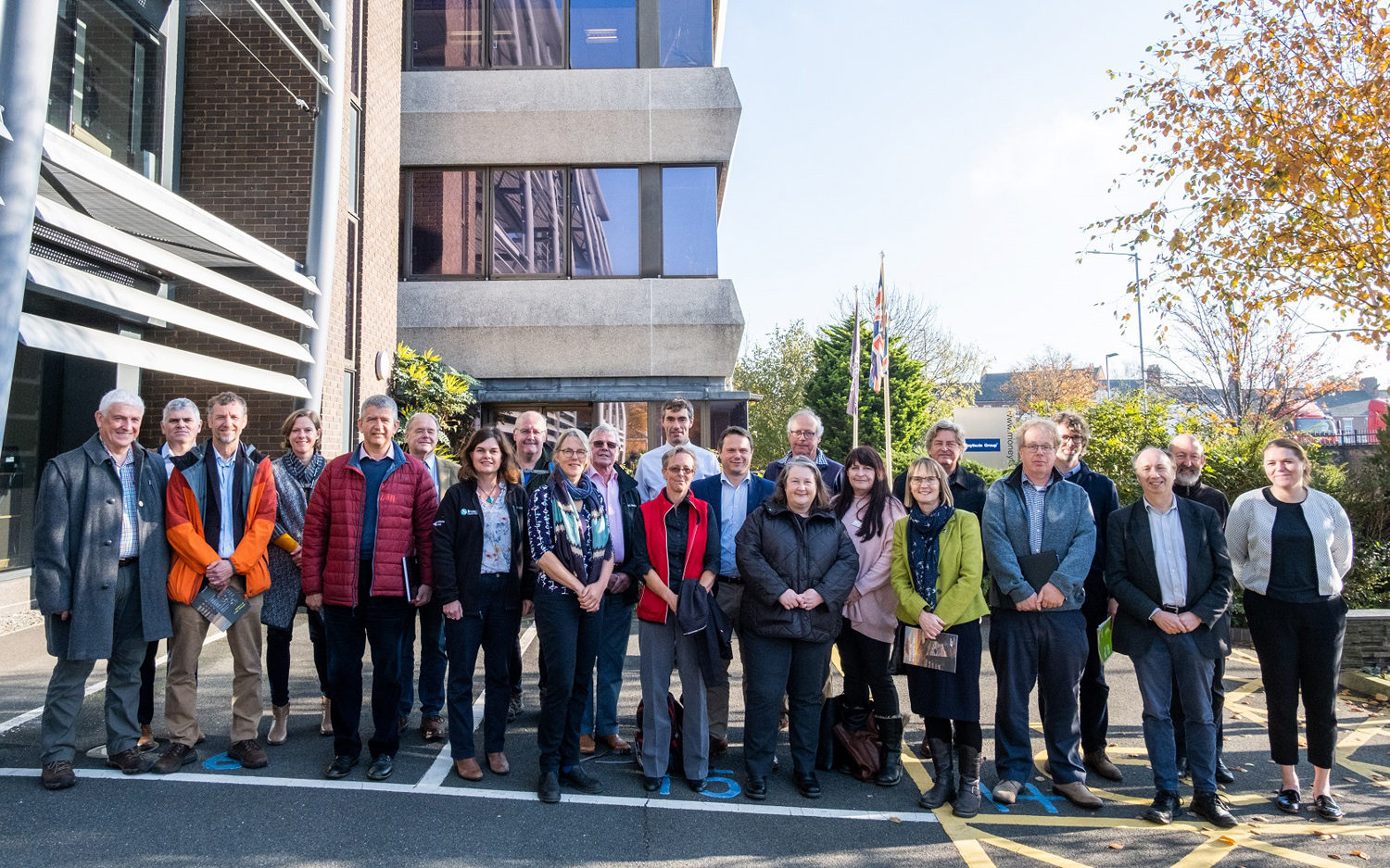 partners stood outside during the broads plan launch