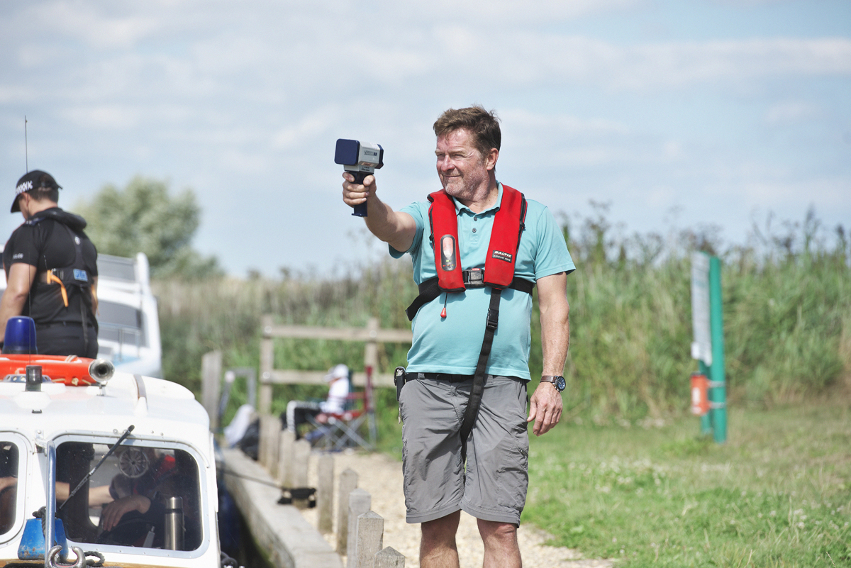 Ranger holding a speed gun