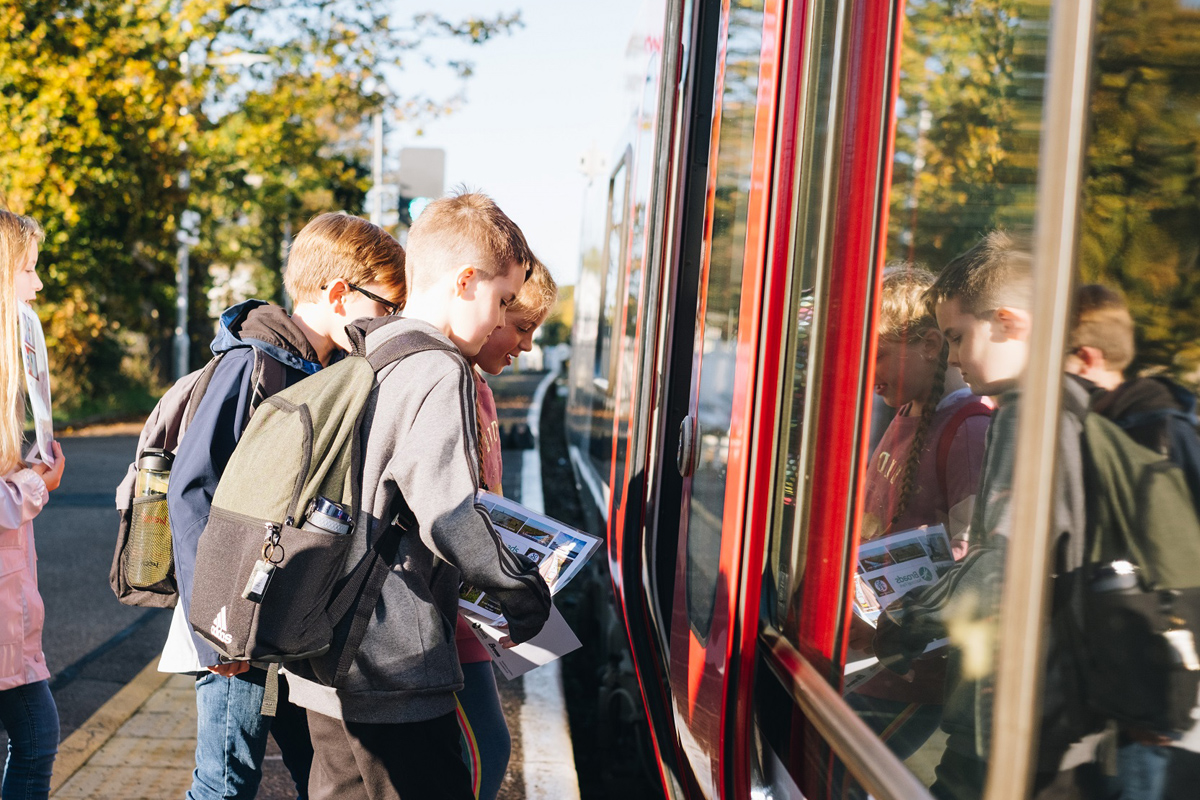 Group of children boarding a train