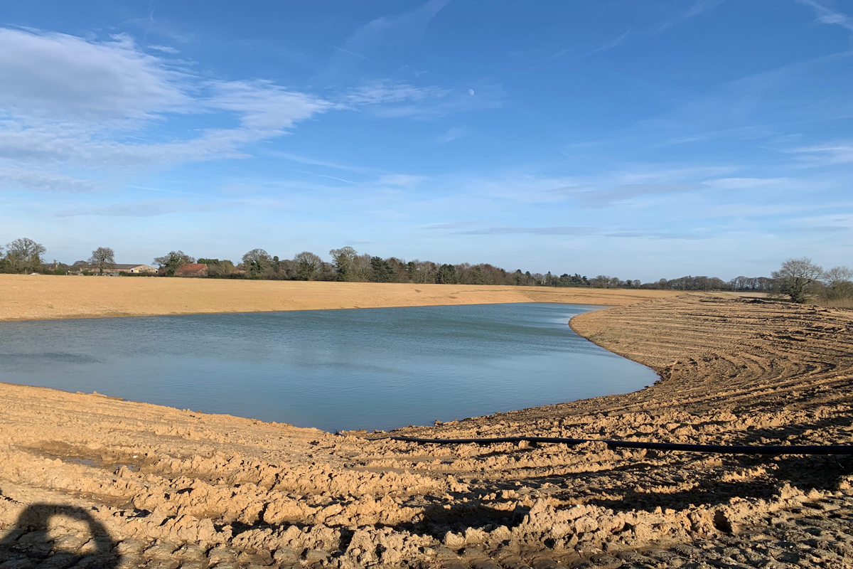 a body of water at tunstead on a clear sunny day